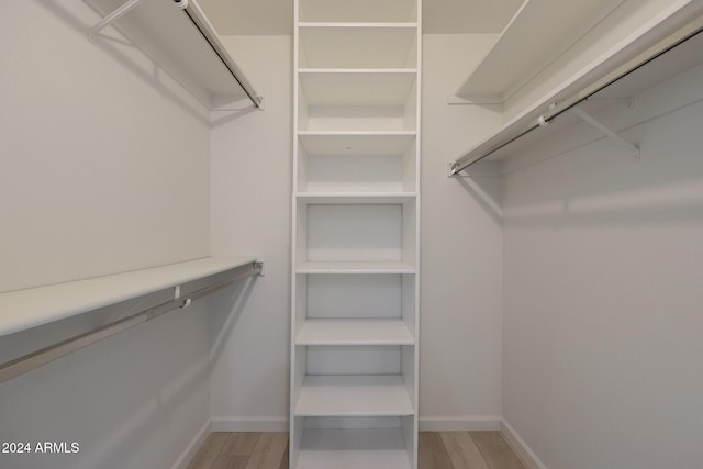 spacious closet with light wood-type flooring