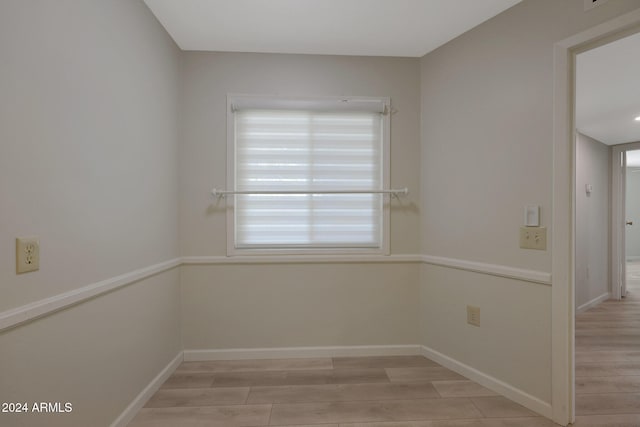 spare room featuring light wood-type flooring