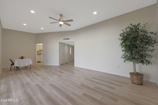 spare room featuring light wood-type flooring and ceiling fan