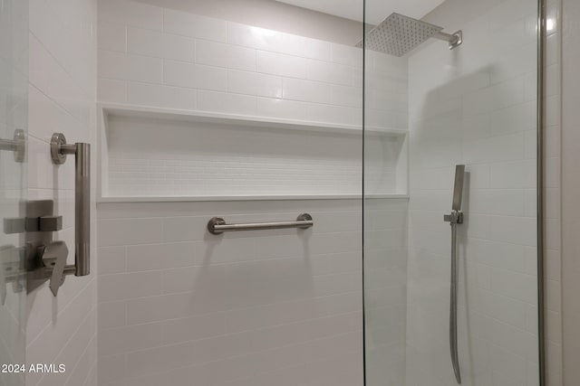 bathroom with tiled shower