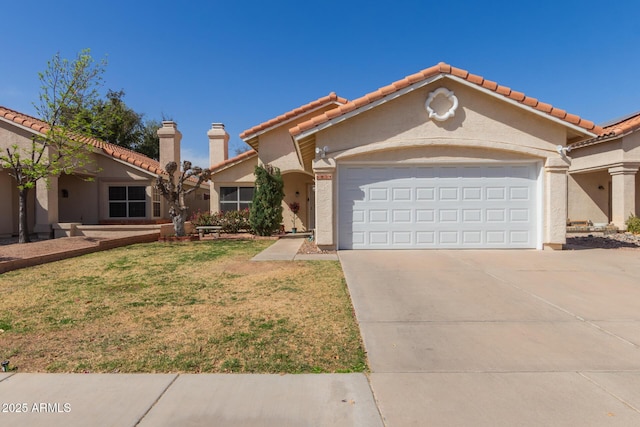 mediterranean / spanish house with a front yard, stucco siding, a chimney, a garage, and driveway