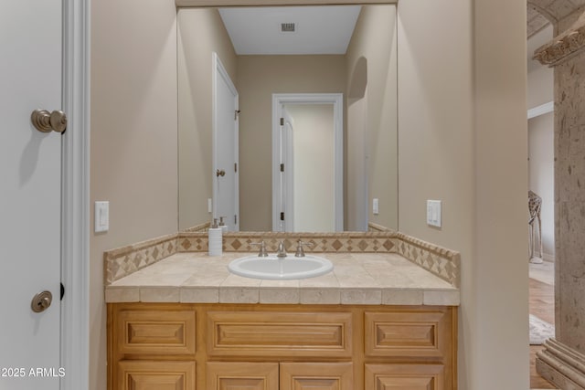 bathroom featuring vanity and visible vents