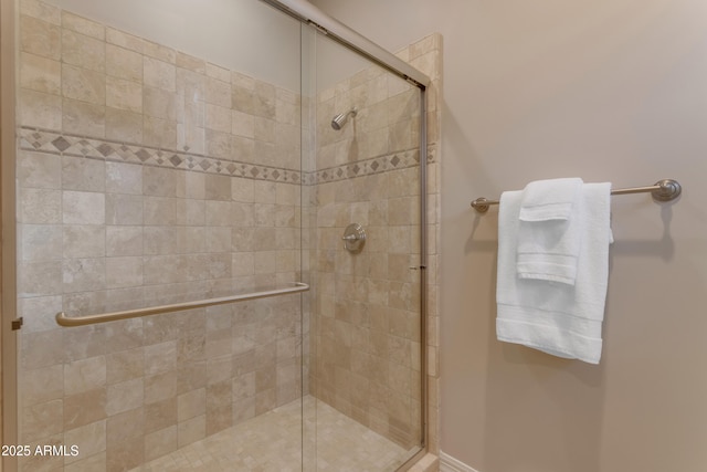 bathroom featuring a shower stall