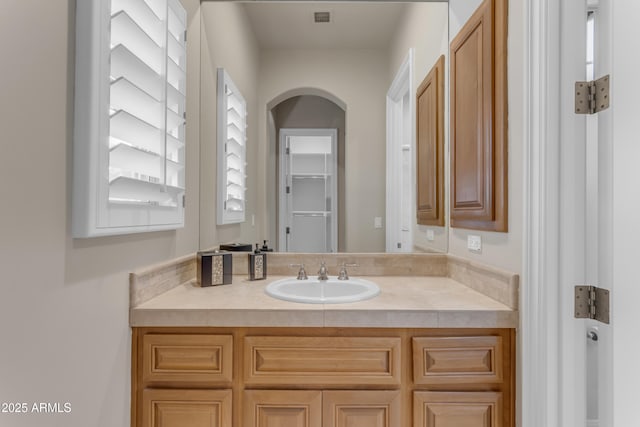 bathroom with vanity and visible vents