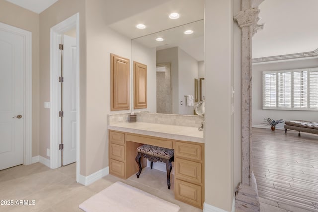 bathroom with recessed lighting, baseboards, and vanity