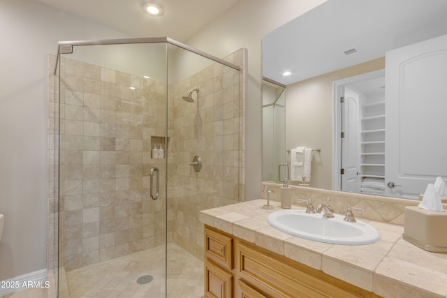 full bath with recessed lighting, a stall shower, and vanity