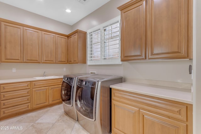 laundry area with visible vents, recessed lighting, washer and dryer, cabinet space, and a sink