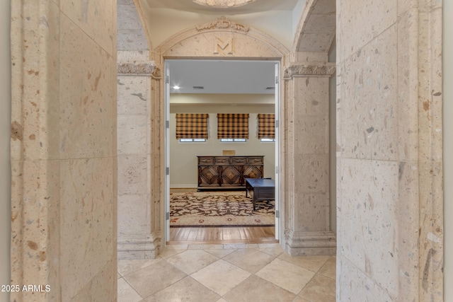 hall with tile patterned flooring