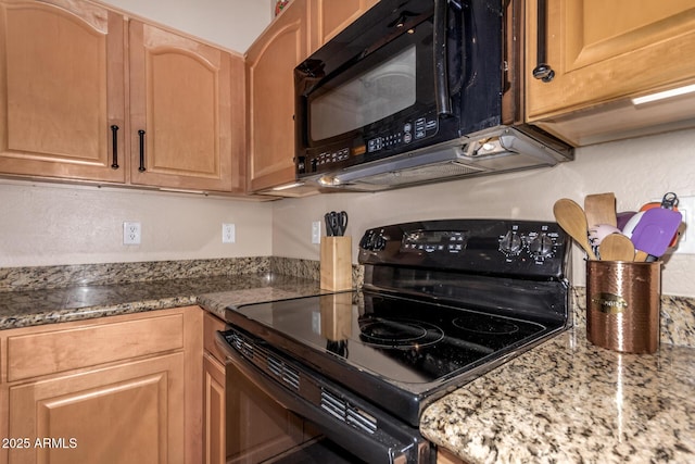 kitchen with black appliances and light stone countertops