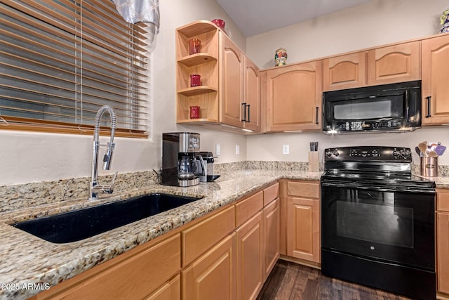 kitchen featuring a sink, black appliances, dark wood-style floors, light stone countertops, and light brown cabinets
