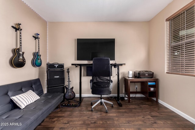 office area featuring baseboards and wood finished floors