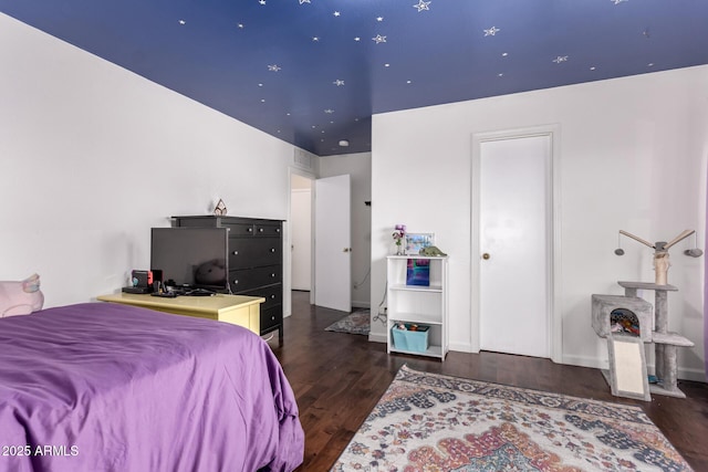 bedroom with wood finished floors