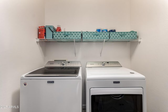 washroom with laundry area and independent washer and dryer