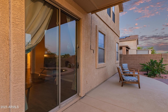 view of patio / terrace featuring fence