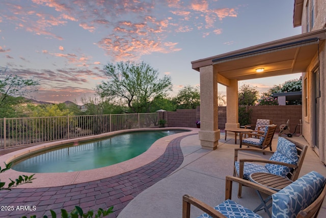 view of pool featuring a fenced backyard, a patio area, a fenced in pool, and an outdoor hangout area