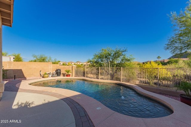 view of pool featuring a patio, a fenced in pool, and a fenced backyard