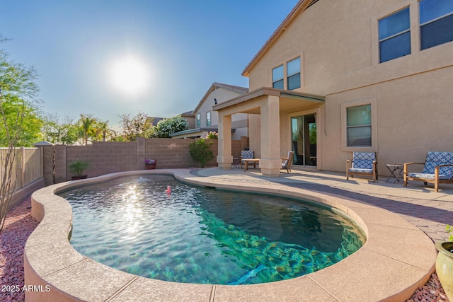 view of pool with a patio, a fenced in pool, and a fenced backyard