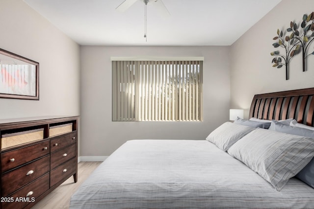 bedroom featuring light hardwood / wood-style flooring and ceiling fan