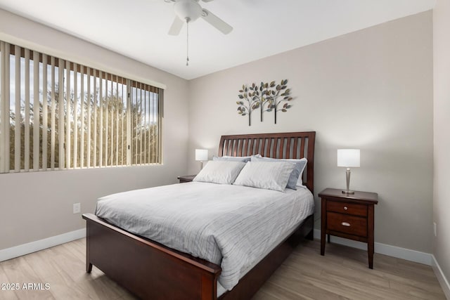 bedroom featuring ceiling fan and light hardwood / wood-style floors