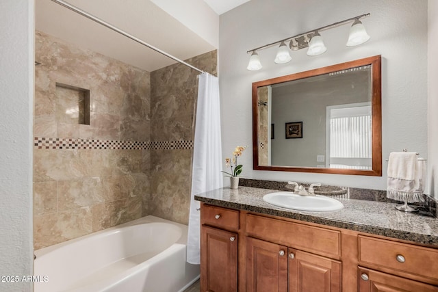 bathroom featuring vanity and shower / bath combo