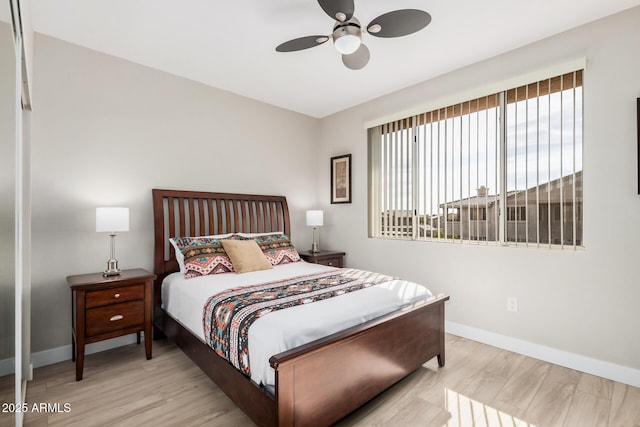 bedroom featuring light hardwood / wood-style flooring and ceiling fan