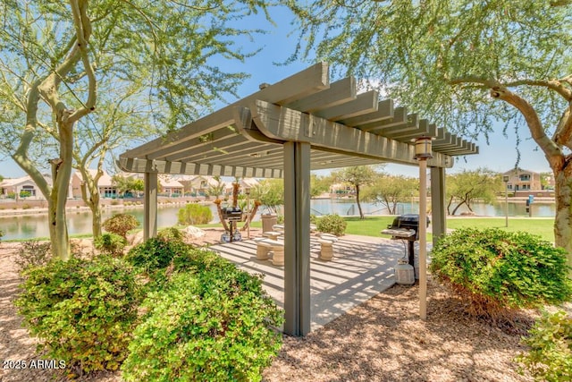 view of home's community featuring a water view, a pergola, and a patio