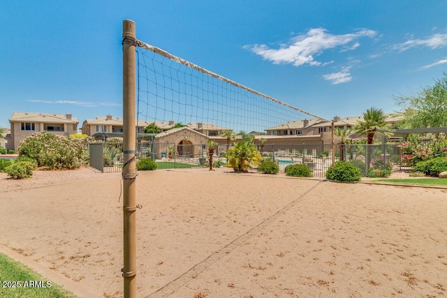 view of property's community with a swimming pool and volleyball court