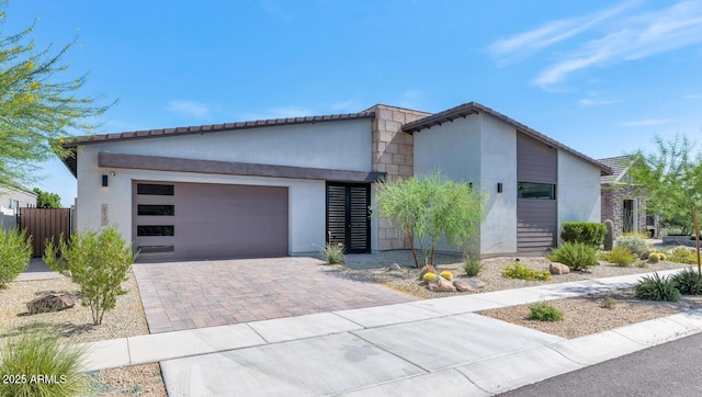 812 E Summerside Rd, Phoenix, AZ 85042 - modern home with stucco siding, a garage, and decorative driveway