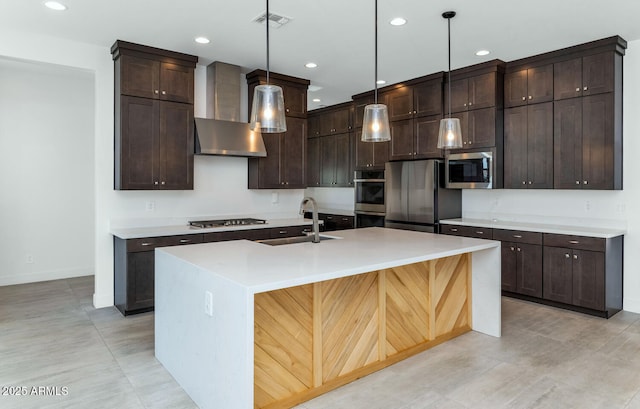 812 E Summerside Rd, Phoenix, AZ 85042 - kitchen featuring a sink, appliances with stainless steel finishes, dark brown cabinetry, wall chimney range hood, and recessed lighting