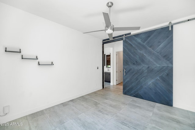 812 E Summerside Rd, Phoenix, AZ 85042 - spare room with a barn door and a ceiling fan