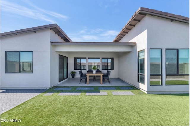 812 E Summerside Rd, Phoenix, AZ 85042 - rear view of house featuring a patio area, stucco siding, and a yard