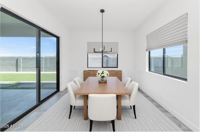 812 E Summerside Rd, Phoenix, AZ 85042 - dining space featuring a chandelier and baseboards