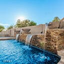view of pool featuring fence