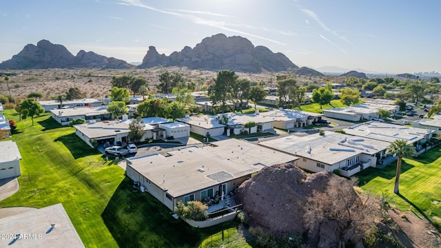 birds eye view of property featuring a mountain view