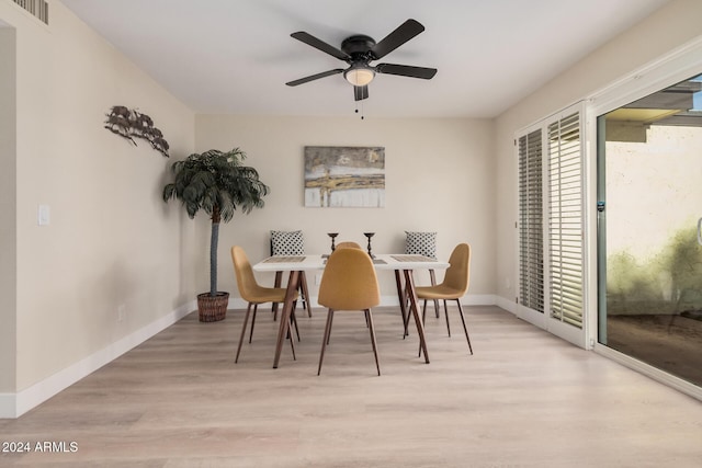 dining room featuring light hardwood / wood-style floors and ceiling fan