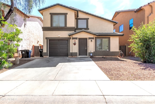 traditional-style house featuring stucco siding, an attached garage, driveway, and a tile roof