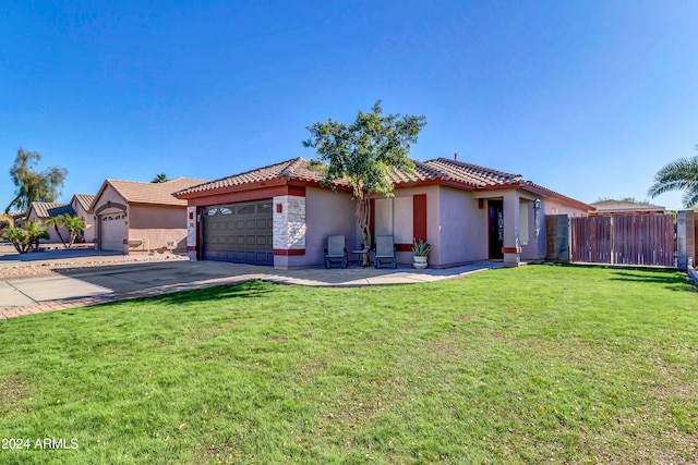 view of front facade with a garage and a front yard