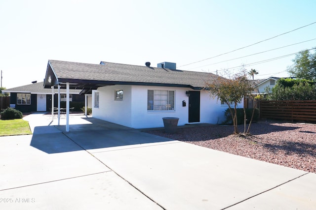 ranch-style home with a carport