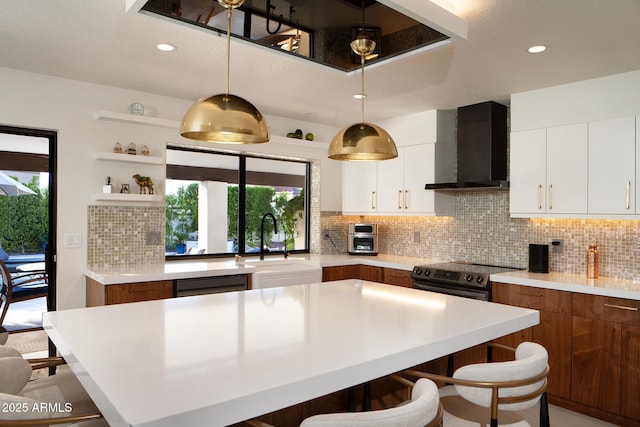 8332 E San Simon Dr, Scottsdale, AZ 85258 - kitchen featuring wall chimney range hood, black dishwasher, a breakfast bar area, electric stove, and a sink