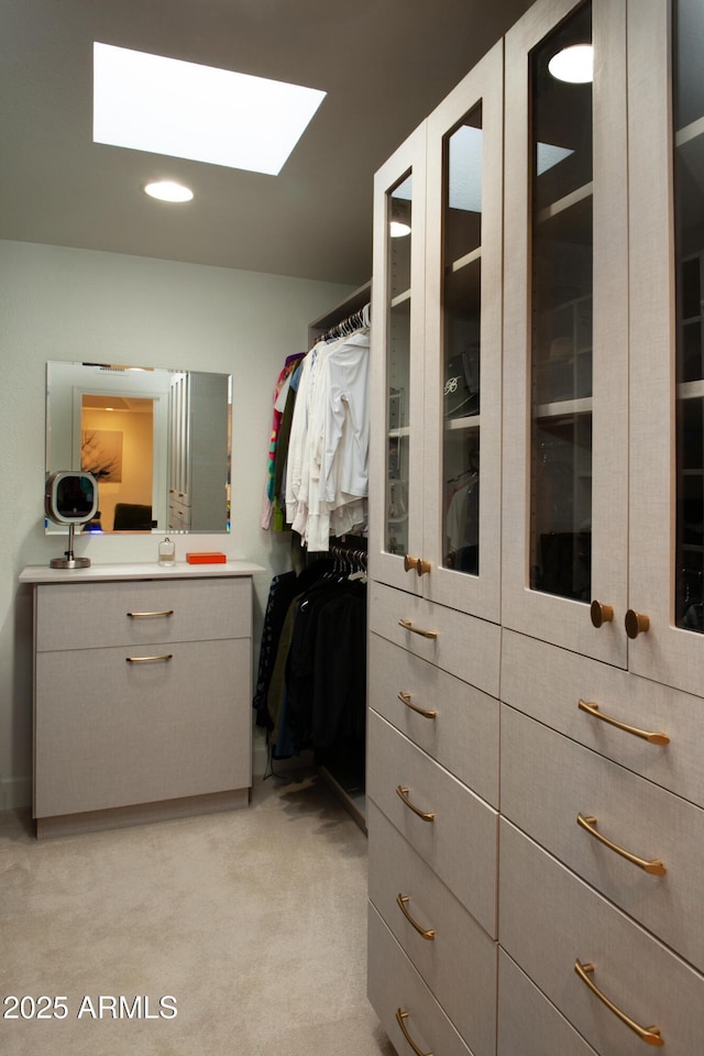 8332 E San Simon Dr, Scottsdale, AZ 85258 - walk in closet featuring a skylight and light carpet