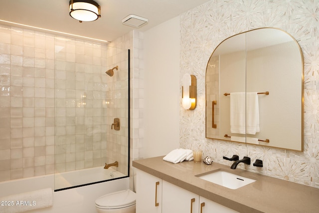 8332 E San Simon Dr, Scottsdale, AZ 85258 - bathroom featuring backsplash, toilet, bathtub / shower combination, and vanity