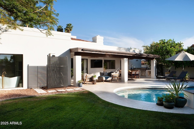 8332 E San Simon Dr, Scottsdale, AZ 85258 - back of property featuring a patio, stucco siding, an outdoor living space, area for grilling, and a lawn