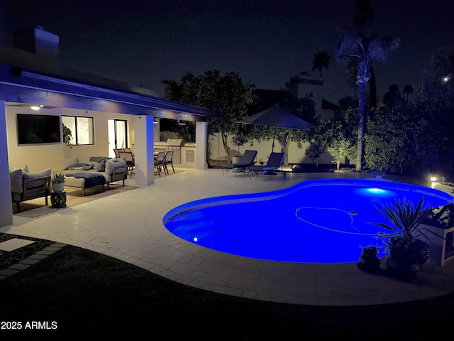 8332 E San Simon Dr, Scottsdale, AZ 85258 - pool at night with an outdoor pool, a patio, and an outdoor living space