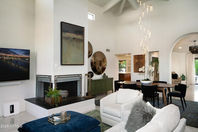 8332 E San Simon Dr, Scottsdale, AZ 85258 - living room with arched walkways, visible vents, a high ceiling, and a healthy amount of sunlight