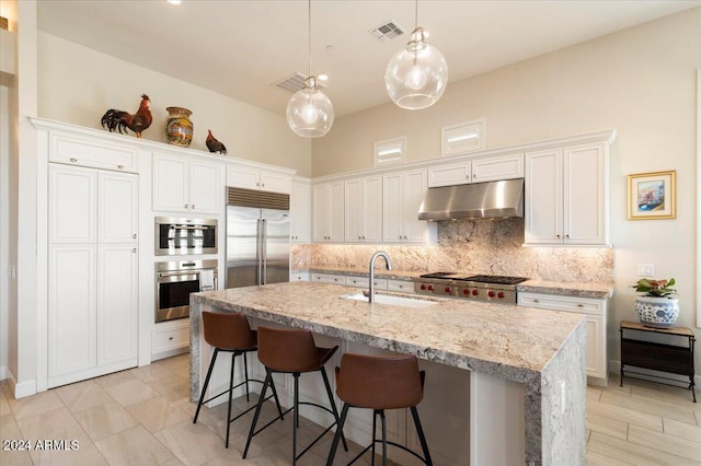 kitchen with white cabinetry, sink, and appliances with stainless steel finishes