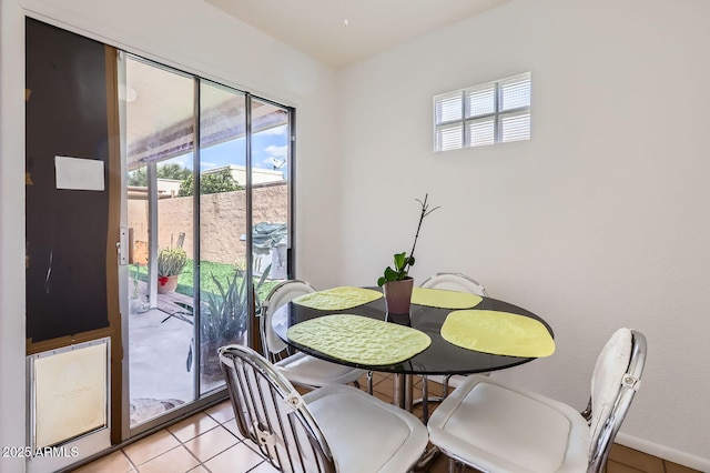 dining space with light tile patterned flooring