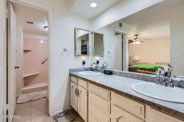 full bathroom with tile patterned flooring, visible vents, a sink, and double vanity