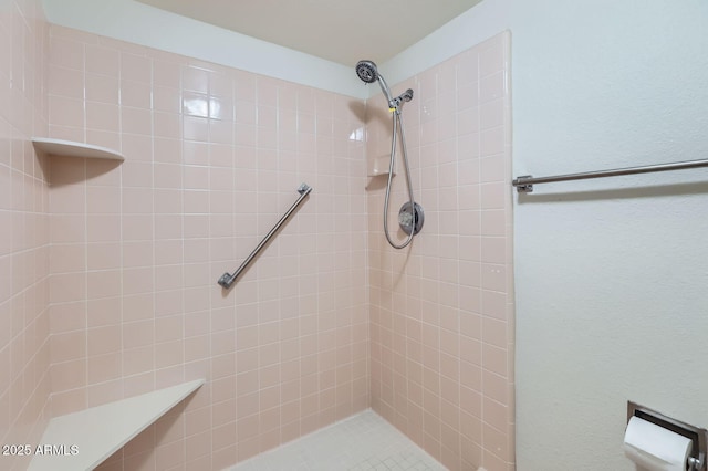 full bath featuring a tile shower