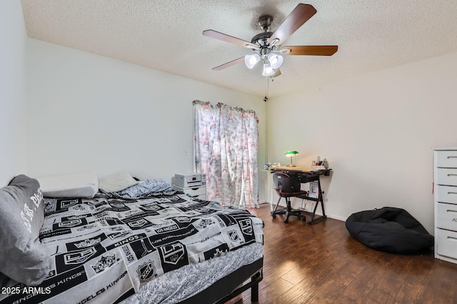 bedroom featuring a ceiling fan, a textured ceiling, and hardwood / wood-style flooring