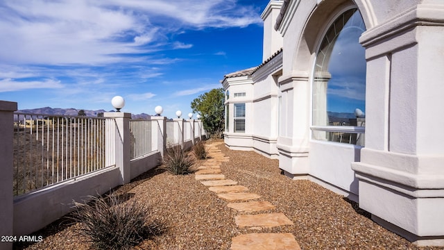 view of side of home featuring a mountain view